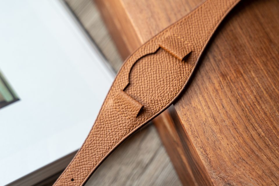 Honey-coloured centre pad, showing fine grain and low-contrast stitching.